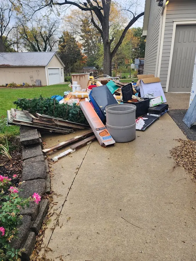 Dumpster being loaded with debris for 30 Yard Dumpster Rental in Winchester